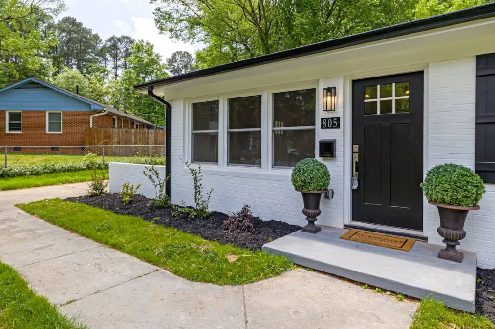 Front porch of a home with a door for smart doorbell